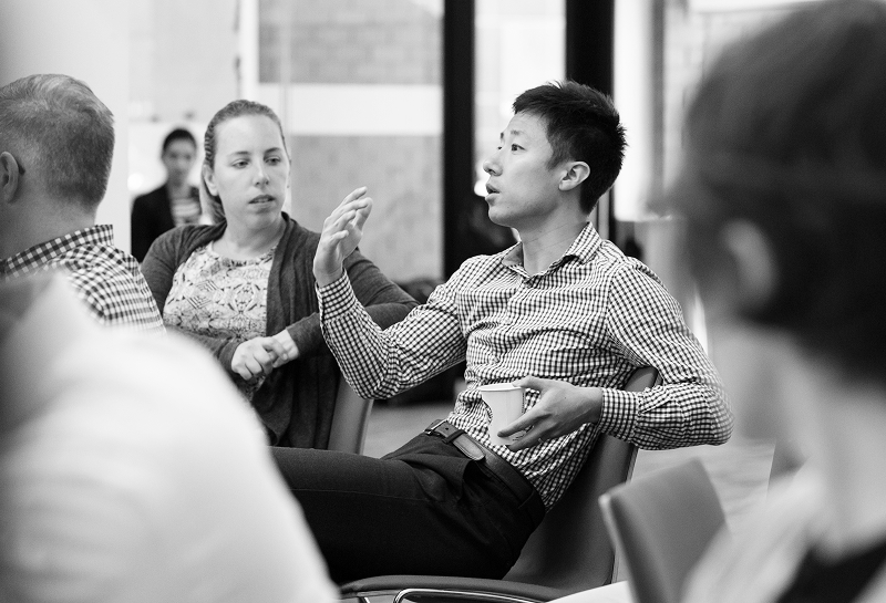 Young man speaking in a conference room